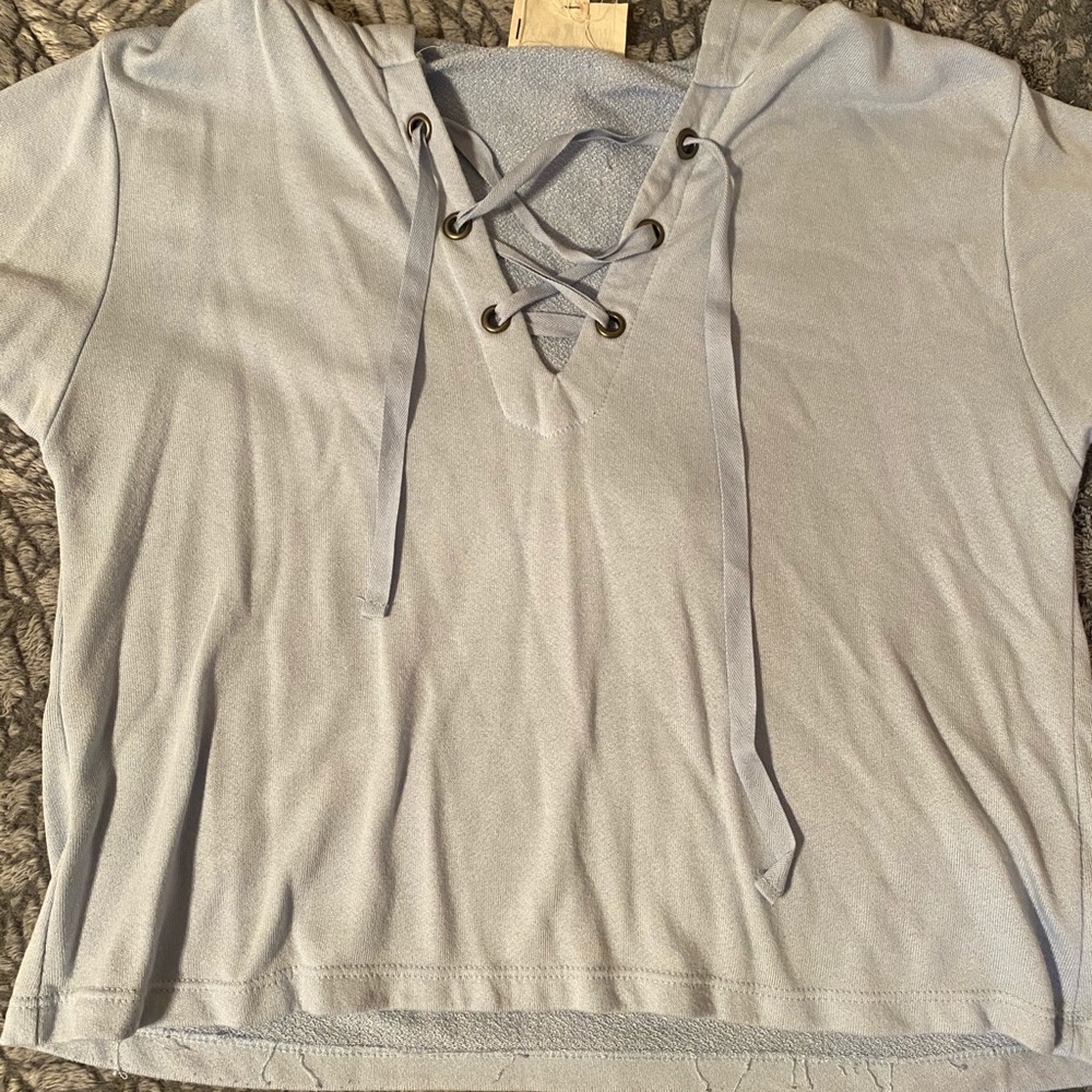 This is a short-sleeve top in a light blue color